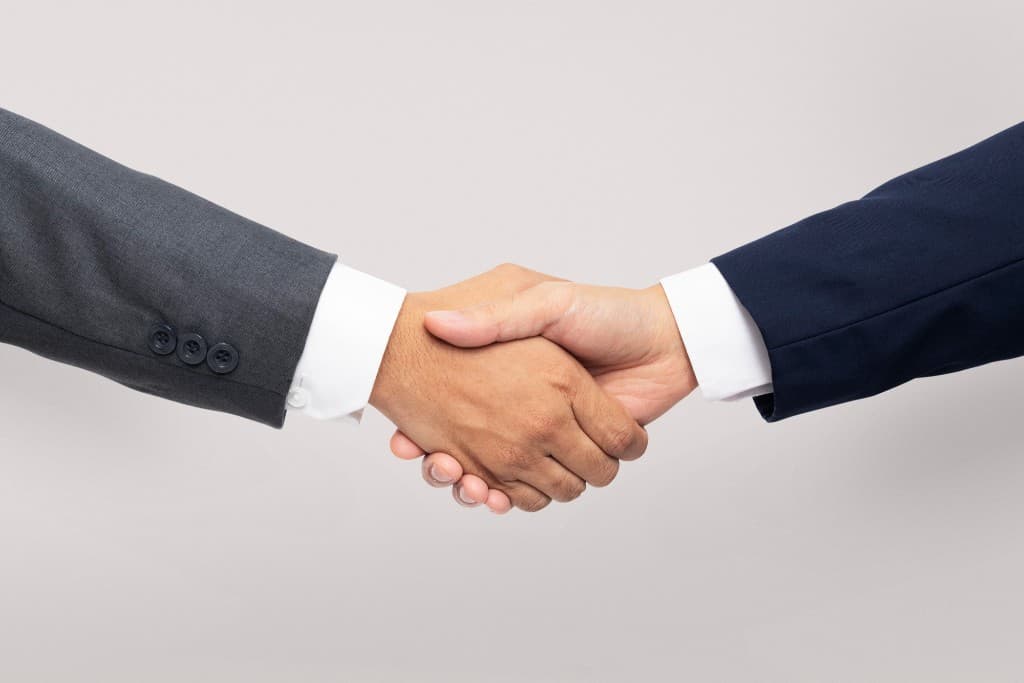 Handshake between business partners representing trusted long-term collaboration